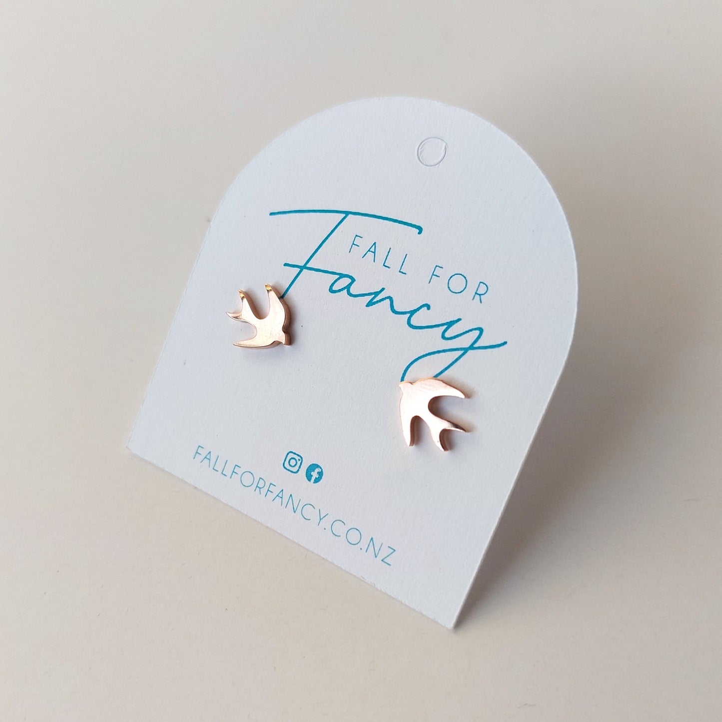 small bird studs in rose gold stainless steel