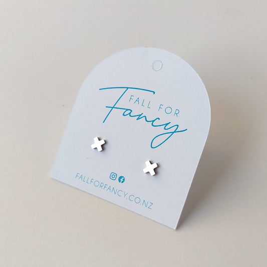 Tiny cross earrings in silver coloured stainless steel