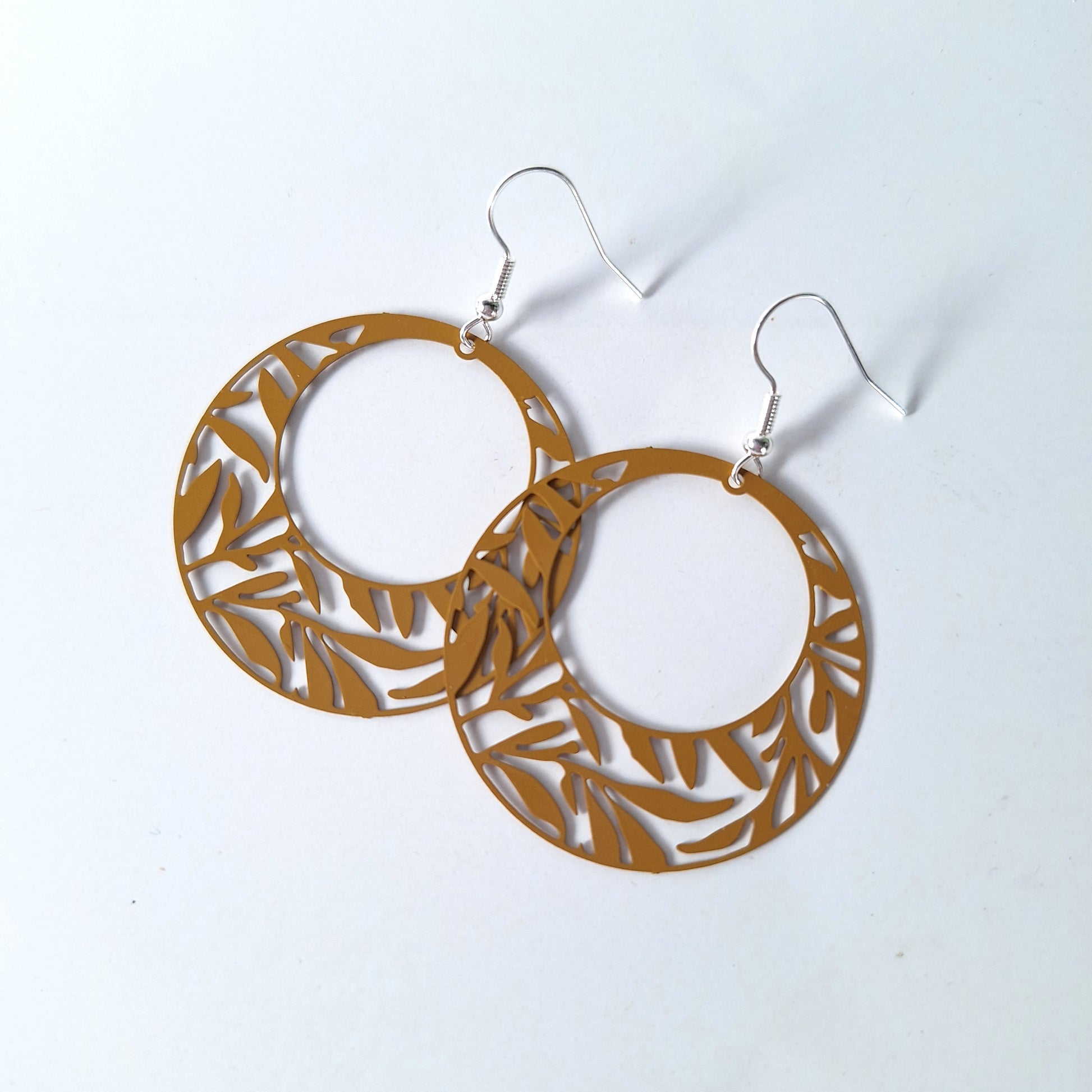 Round foliage earrings featuring leaves in mustard by Fall for Fancy